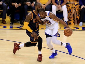 Kevin Durant of the Golden State Warriors drives with the ball against LeBron James of the Cleveland Cavaliers in Game 1 of the NBA Finals at ORACLE Arena on June 1, 2017. (Ronald Martinez/Getty Images)
