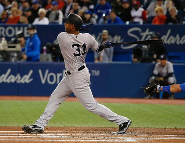 New York Yankees Aaron Hicks CF (31) doubles to right scoring three runs in the first inning in Toronto, Ont. on Thursday June 1, 2017. Jack Boland/Toronto Sun/Postmedia Network