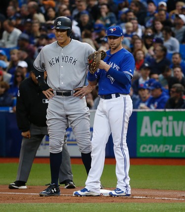New York Yankees Aaron Judge RF (99) standing beside Toronto Blue Jays Justin Smoak 1B (14) after a single in the first inning  in Toronto, Ont. on Thursday June 1, 2017. Jack Boland/Toronto Sun/Postmedia Network