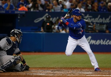 Toronto Blue Jays Josh Donaldson 3B (20) does a kickstand move as a ball comes in low and tight in Toronto, Ont. on Thursday June 1, 2017. Jack Boland/Toronto Sun/Postmedia Network