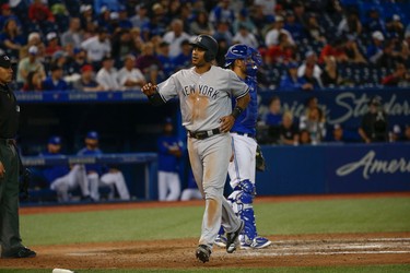 New York Yankees Aaron Hicks CF (31) scores in the ninth inning. Hicks had three doubles, four hits and six RBIs in the 12-2 drubbing of the Toronto Blue Jays  in Toronto, Ont. on Thursday June 1, 2017. Jack Boland/Toronto Sun/Postmedia Network