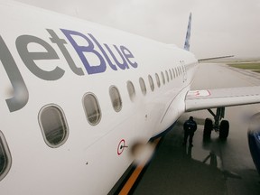 A JetBlue Airways jet sits on the tarmac at O'Hare Airport October 26, 2006 in Chicago, Illinois.  (Photo by Scott Olson/Getty Images)