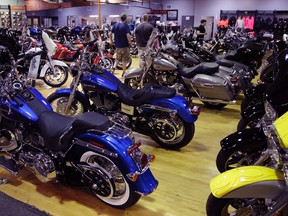 In this Monday, April 24, 2017, photo, Harley-Davidson motorcycles are displayed on the showroom floor at the Motorcycles of Manchester dealership in Manchester, N.H. (AP Photo/Charles Krupa)