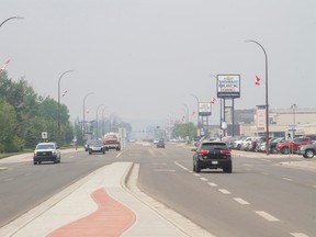 A smoky haze from fires burning throughout the municipality covers downtown Fort McMurray, as seen from Franklin Avenue near Centennial Drive, on Friday, June 2, 2017. Robert Murray/Fort McMurray Today/Postmedia Network