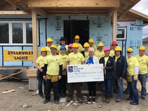 BRUCE BELL/THE INTELLIGENCER
The Royal Bank sent 17 employees to the Habitat for Humanity on Donald Street in Belleville on Friday. Not only did they spend the day helping with the build, the bank also donated $11,000.