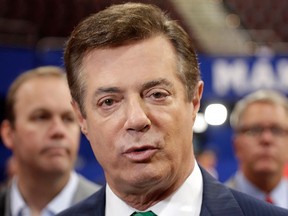 In this July 17, 2016 file photo, then-Trump campaign chairman Paul Manafort talks to reporters on the floor of the Republican National Convention at Quicken Loans Arena in Cleveland.  (AP Photo/Matt Rourke, File)