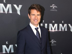 In this Monday, May 22, 2017 file photo, actor Tom Cruise arrives for the Australian premiere of his movie "The Mummy," in Sydney. The 54-year-old actor says the long-discussed sequel to "Top Gun" is a sure thing and should start shooting soon. (AP Photo/Rick Rycroft, File)