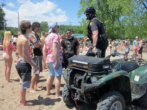 OPP will be out in force for the unofficial Beach Day celebration at Turkey Point and elsewhere in Norfolk this Friday. This was a scene from last year's beach day. MONTE SONNENBERG / SIMCOE REFORMER FILE