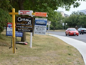 For-sale signs for Ottawa properties.