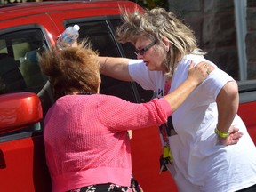 Susan Horvath, daughter of Arpad Horvath Sr., one of former nurse Elizabeth Wettlaufer?s victims, is comforted after leaving the courthouse in Woodstock where Wettlaufer pleaded guilty to eight charges of first-degree murder. Columnist Larry Cornies says we should accept and affirm a wide range of responses from family and friends of Wettlaufer?s victims as they continue their bruising journey to that elusive state of closure. (MORRIS LAMONT, The London Free Press)