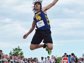 Kieran Lewis (ENSS) reaches for the sky during junior boys long jump competition Friday at the 2017 OFSAA track and field championships at the MAS Park complex. (Catherine Frost for The Intelligencer)