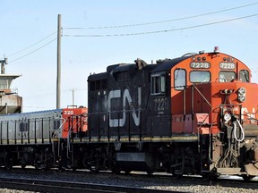 A CN locomotive goes through the CN Taschereau yard in Montreal, Saturday, Nov., 28, 2009. The union representing approximately 3,000 employees at Canadian National Railway says it has reached a verbal agreement with the company, hours before the workers were in a legal strike position. THE CANADIAN PRESS/Graham Hughes
