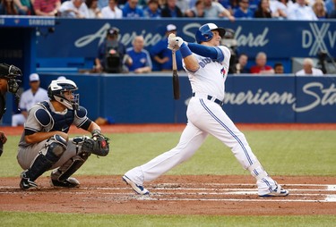 Toronto Blue Jays Justin Smoak 1B (14) hits a two run HR driving in Kendrys Morales in the first inning in Toronto, Ont. on Friday June 2, 2017. Jack Boland/Toronto Sun/Postmedia Network