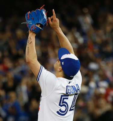 Toronto Blue Jays Roberto Osuna P (54) points to the sky after getting his 12th save of the season after beating the New York Yankees 7-5 inning in Toronto, Ont. on Friday June 2, 2017. Jack Boland/Toronto Sun/Postmedia Network