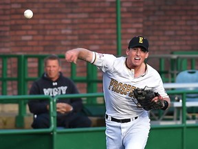 Edmonton Prospects third baseman Anthony Olson throws the ball to first base against the Brooks Bombers during their season opener at Re/Max Field in Edmonton, June 2, 2017.