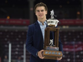 CHL Rookie of the Year Award recipient Nico Hischier, from the Halifax Mooseheads, holds his trophy following a media availability at the Memorial Cup in Windsor, Ont., on May 27, 2017. (Adrian Wyld/The Canadian Press)