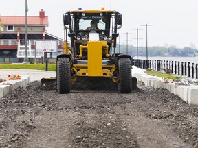 Luke Hendry/Intelligencer File Photo
A worker grades gravel at Meyers Pier Thursday, May 18, 2017 in Belleville, Ont.