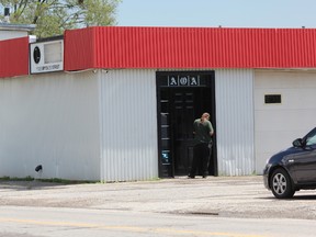 A man waits to be allowed into the Outlaws Motorcycle Club London chapter's clubhouse at 1103 Brydges St. on Tuesday, May 30, 2017. DALE CARRUTHERS / THE LONDON FREE PRESS