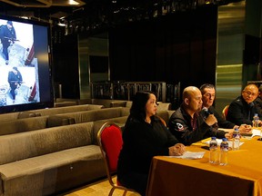 Police authorities and Resorts World Manila complex security play a CCTV video of the gunman who stormed the casino and hotel complex, during a news conference on Saturday, June 3, 2017, in Manila, Philippines. (AP Photo/Bullit Marquez)