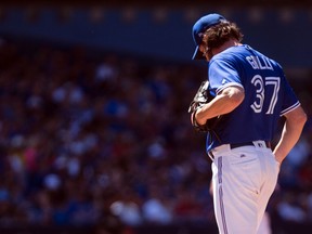 Toronto Blue Jays relief pitcher Jason Grilli reacts after a home run by New York Yankees second baseman Starlin Castro in Toronto on Saturday, June 3, 2017. (THE CANADIAN PRESS/Chris Young)