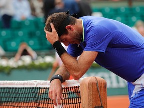 Juan Martin del Potro stops at the net after losing the first set against Andy Murray during the French Open at the Roland Garros stadium, Saturday, June 3, 2017 in Paris. (AP Photo/Christophe Ena)