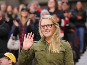 Brooke Henderson waves to the crowd when she attends an Ottawa Senators NHL home game against the Florida Panthers in December 2016.