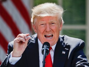 President Donald Trump gestures while speaking about the U.S. role in the Paris climate change accord, Thursday, June 1, 2017, in the Rose Garden of the White House in Washington. (AP Photo/Pablo Martinez Monsivais)