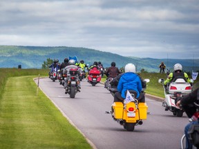Participants in the TELUS Ride for Dad in Ottawa on Saturday head down the road from the Canada Aviation and Space Museum.