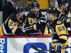 Pittsburgh Penguins forward Jake Guentzel (59) celebrates his goal against the Nashville Predators with teammates Scott Wilson, left, and Conor Sheary, centre, during Game 2 of the Stanley Cup Final, Wednesday, May 31, 2017, in Pittsburgh. (AP Photo/Keith Srakocic)