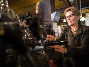 Premier Kathleen Wynne, shown here in 2014, and her Liberal government have proposed an increase in the minimum wage in Ontario to $15 per hour by 2019.