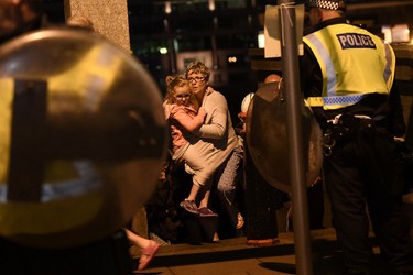 People are lead to safety on Southwark Bridge away from London Bridge after an attack on June 4, 2017 in London, England.(Carl Court/Getty Images)