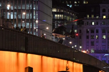 An emergency response helicopter lands on London Bridge, the scene of a terror attack in central London on June 3, 2017.  (CHRIS J. RATCLIFFE/AFP/Getty Images)