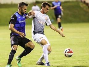 FC Edmonton midfielder Adam Straith, left, challenges Puerto Rico FC midfielder Conor Doyle for the ball in North American Soccer League play at Juan Ramon Loubriel Stadium in Bayamon, Puerto Rico, on Saturday, June 3, 2017.