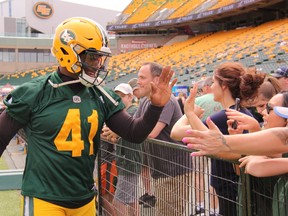 Eskimos defensive end Odell Willis meets fans during Eskimos Fan Day at Commonwealth Stadium in Edmonton on Tuesday, July 4, 2017.