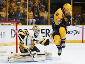 Matt Murray #30 of the Pittsburgh Penguins tends to net as Viktor Arvidsson #38 of the Nashville Predators looks to avoid the puck during the second period in Game Three of the 2017 NHL Stanley Cup Final at the Bridgestone Arena on June 3, 2017 in Nashville, Tennessee. (Photo by Bruce Bennett/Getty Images)