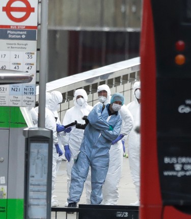 Forensic police work within a cordoned off area after an attack in the London Bridge area of London, Sunday, June 4, 2017. (AP Photo/Matt Dunham)