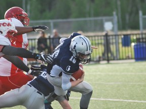 Sudbury Spartans' quarterback Aaron Campbell is brought down by Steel City Patriots' players during the Spartans' home-opener at James Jerome Sports Complex on Saturday. The Spartans lost 37-10. Keith Dempsey/For The Sudbury Star