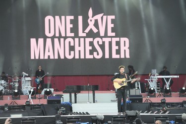 In this handout provided by One Love Manchester benefit concert Marcus Mumford performs on stage on June 4, 2017 in Manchester, England. (Getty Images/Dave Hogan for One Love Manchester)