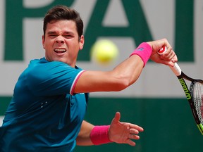 Canada's Milos Raonic plays a shot against Spain's Pablo Carreno Busta during their fourth round match at the French Open in Paris, France on Sunday, June 4, 2017. (Christophe Ena/AP Photo)