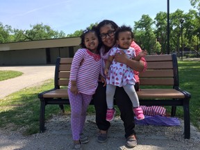Jerusalem Kahsay (centre) with daughters Sara (left) and Samra (on lap) pose for a photo at Vimy Rdige Park in Winnipeg on Friday, June 2, 2017. Jerusalem is going to Toronto on June 27 for the Shave Mom Event, hosted by Childhood Cancer Canada to raise funds and awareness for children with cancer. Her daughter Sara was diagnosed with a rare form of blood cancer at the age of two.