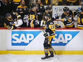 Penguins' Nick Bonino (13) celebrates his goal against the Predators with teammates on the bench during Game 1 of the hockey Stanley Cup final in Pittsburgh on May 29, 2017. (Gene J. Puskar/AP Photo)