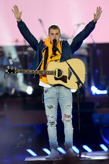 In this Sunday, June 4, 2017, handout photo provided by Dave Hogan for One Love Manchester, singer Justin Bieber performs at the One Love Manchester tribute concert in Manchester, north western England, Sunday, June 4, 2017. One Love Manchester is raising money for those affected by the bombing at the end of Ariana Grande's concert in Manchester on May 22, 2017. (Dave Hogan via AP)