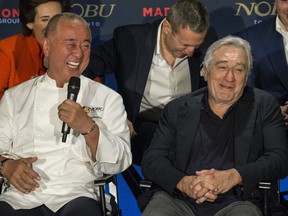 Chef Nobuyuki Matsuhisa, left, laughs with Robert De Niro at a media gathering prior to the opening of a sales office this summer for the luxury highrise project made up of Nobu Hotel, the restaurant Nobu Toronto and condo residences on Mercer St. (CRAIG ROBERTSON/TORONTO SUN)