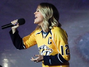 Country music star Carrie Underwood performs the U.S. anthem before a first-round playoff game between the Predators and Blackhawks in Nashville, Tenn., on April 17, 2017. (Mark Humphrey/AP Photo/Files)
