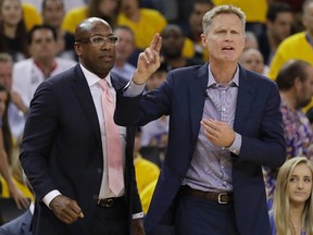 Warriors head coach Steve Kerr (right), next to interim head coach Mike Brown, returned to the bench for Game 2 of the NBA Finals against the Cavaliers in Oakland, Calif., on Sunday, June 4, 2017. (Marcio Jose Sanchez/AP Photo)