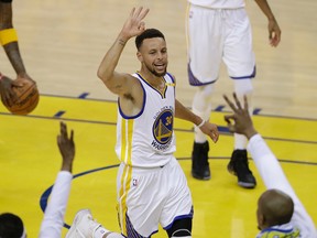 Warriors guard Stephen Curry (30) gestures after scoring against the Cavaliers during Game 2 of the NBA Finals in Oakland, Calif., on Sunday, June 4, 2017. (Marcio Jose Sanchez/AP Photo)
