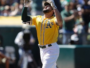 Yonder Alonso celebrates after hitting a two-run home run on June 3, 2017. It was his 16th home run of the season. (BEN MARGOT/AP)