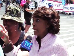 Rep. Maxine Waters with reporter Michael Tracey.