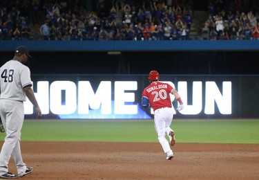 TORONTO, ON - JUNE 4: Josh Donaldson #20 of the Toronto Blue Jays circles the bases after hitting a solo home run in the eighth inning during MLB game action against the New York Yankees at Rogers Centre on June 4, 2017 in Toronto, Canada. (Photo by Tom Szczerbowski/Getty Images)