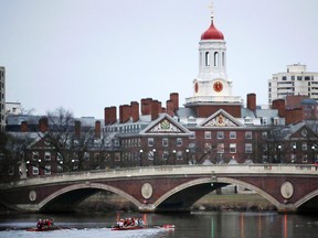 In this March 7, 2017 file photo, rowers paddle along the Charles River past the Harvard College campus in Cambridge, Mass. (AP Photo/Charles Krupa, File)